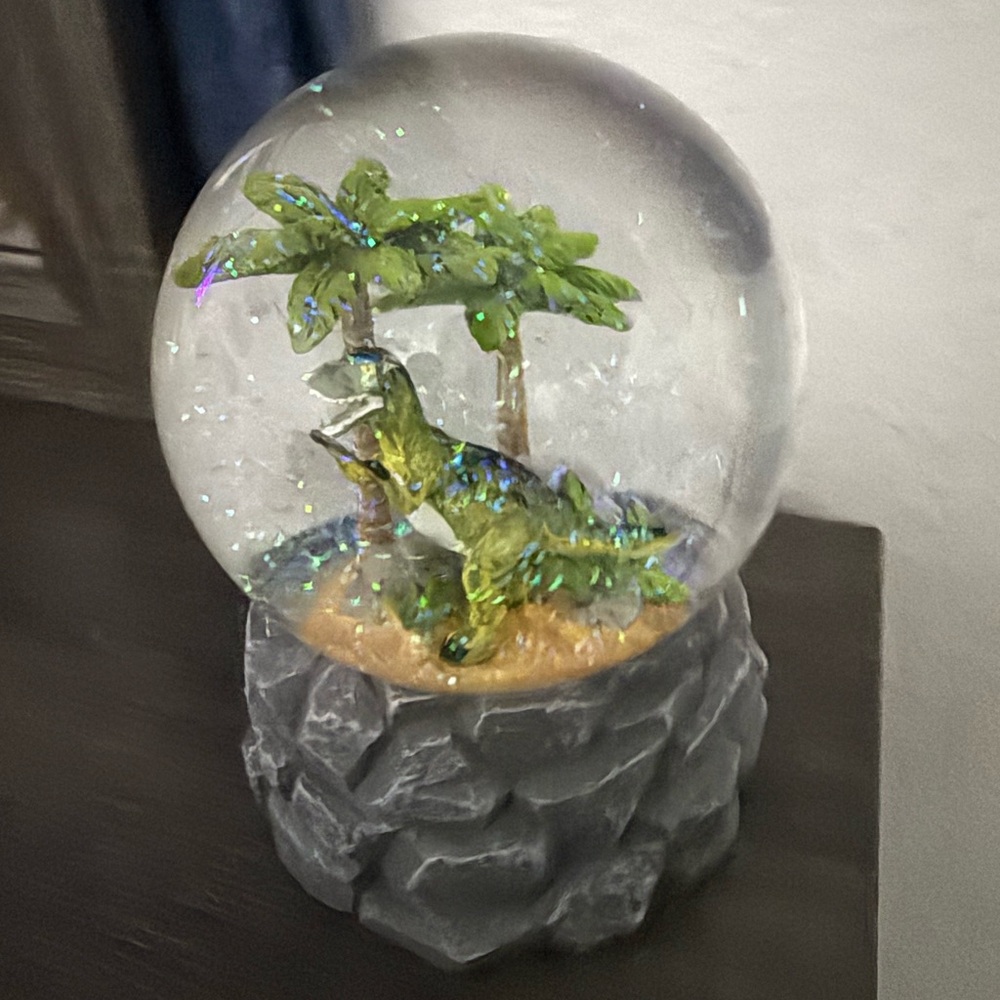 Dinosaur Snow Globe with Palm Trees